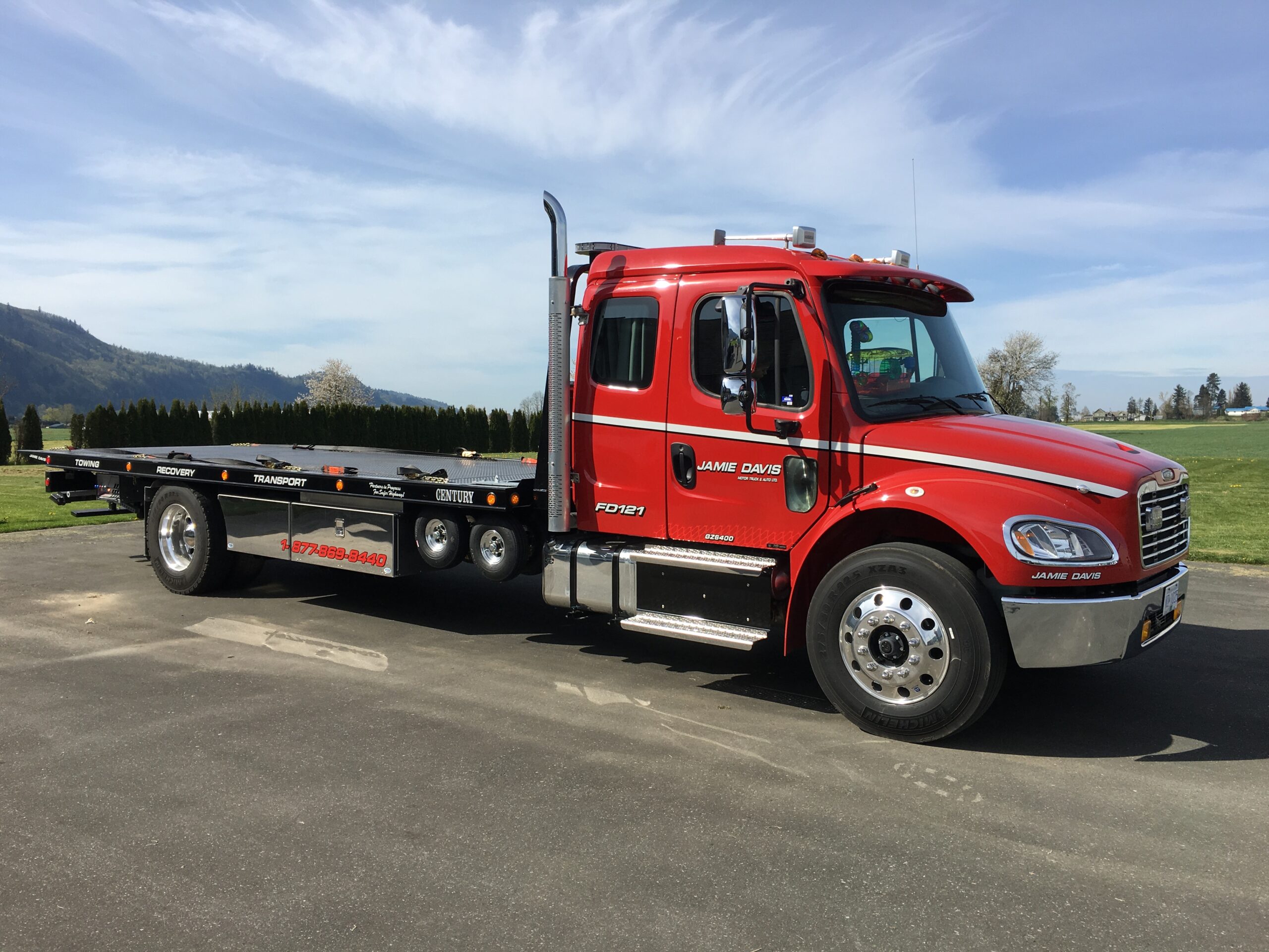 Jamie Davis red flatbed tow truck