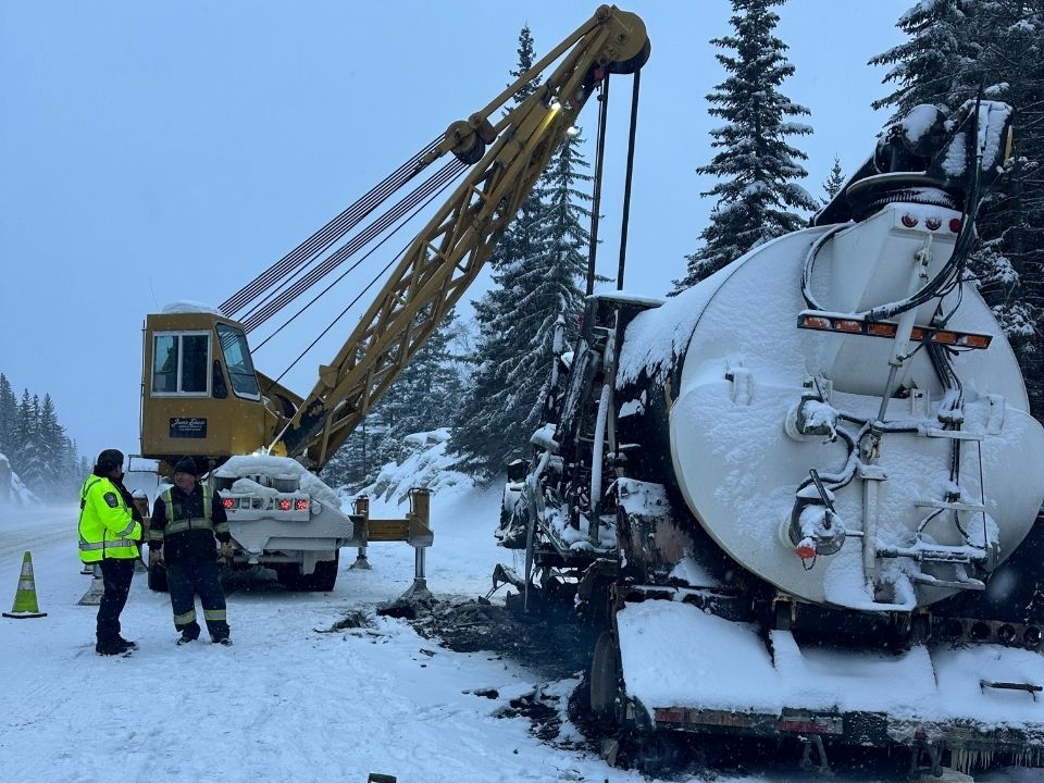 Jamie Davis' Heavy Duty Towing Crane Lifting a Tanker out of a snowy ditch near Hope BC.